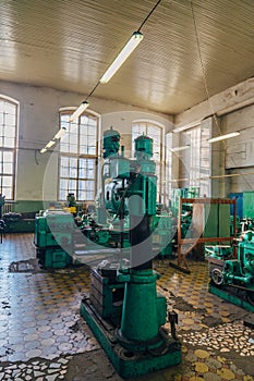 Industrial turning and drilling machine tools in old workshop