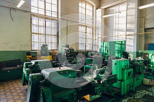 Industrial turning and drilling machine tools in old workshop