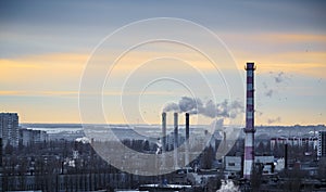 Industrial urban area landscape. Power station with pipes of which poured smoke.