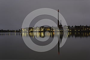 Industrial view by sea at night