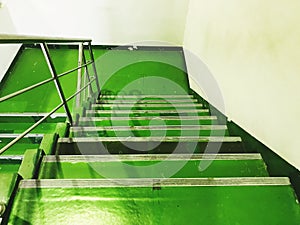 Industrial walkway stairs coated with epoxy green