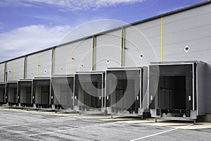 Industrial warehouse loading docks. Warehouse doors. Open gates