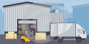 Industrial warehouse for the storage of products. Worker driving forklift loading pallets to refrigerator truck. Industrial