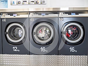 Industrial washing machines in a public laundromat