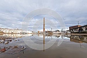 Industrial wasteland with lonely chimney