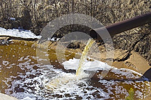 The Industrial Wastewater is Discharged from the Pipe