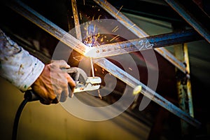 Industrial welder in a small factory