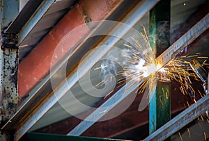 Industrial welder in a small factory