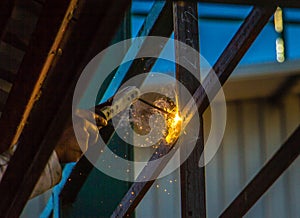 Industrial welder in a small factory