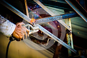 Industrial welder in a small factory