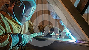 Industrial Welder. Welder works in metal construction