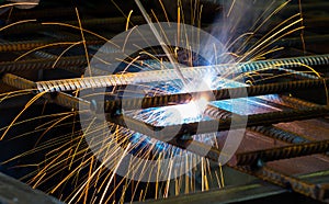 Industrial welders, industrial steel pipe parts, welding workers, steel workpieces