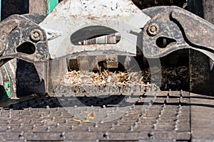 Industrial wood chipper in action