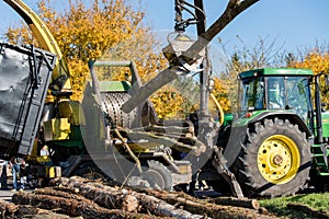 Industrial wood chipper in action