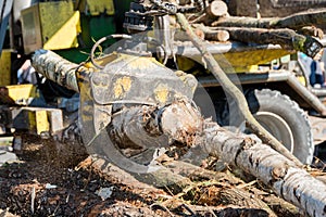 Industrial wood chipper in action