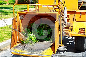 An industrial wood chipper at work