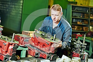 Industrial worker assembling the reduction gear box