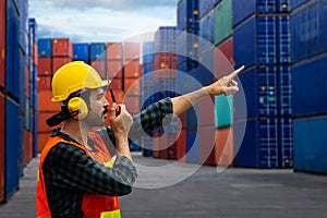 Industrial worker is controlling container loading in import-export business