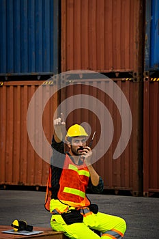 Industrial worker is controlling container loading in import-export business