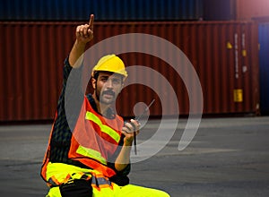 Industrial worker is controlling container loading in import-export business