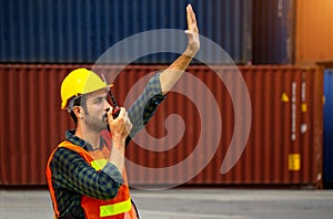 Industrial worker is controlling container loading in import-export business