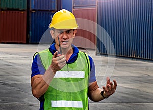 Industrial worker is controlling container loading in import-export business