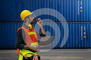 Industrial worker is controlling container loading in import-export business