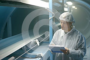 Industrial worker controls the quality of sugar