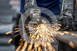 Industrial worker cutting metal