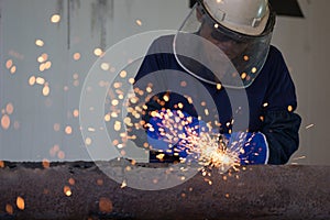 Industrial Worker at the factory welding closeup