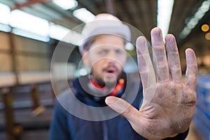 Industrial worker gesturing no