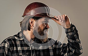 industrial worker in helmet. man with hardhat. construction worker in hard hat. engineer architect working in safety