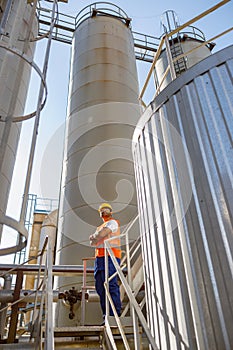 Industrial worker on his job at construction plant