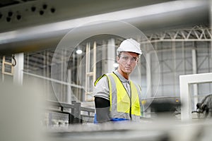 Industrial worker indoors in factory.