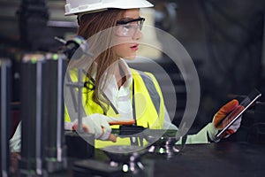 Industrial Worker Inspector Measuring detail with Vernier Caliper