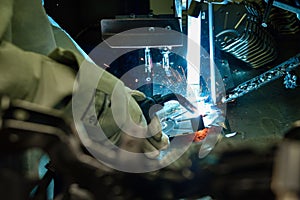 Industrial Worker labourer at the factory welding steel structure