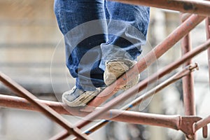 Industrial worker labourer on scaffolding