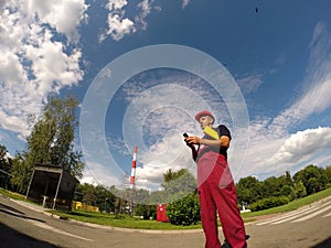 Industrial Worker Looking at His Cell Phone