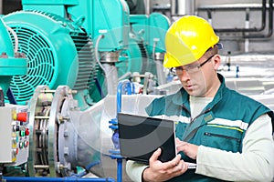 Industrial worker with notebook photo