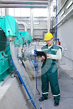 Industrial worker with notebook