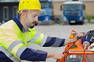 Industrial worker outdoors operating machinery