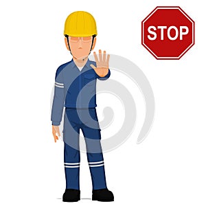 An industrial worker is raise hand to stop