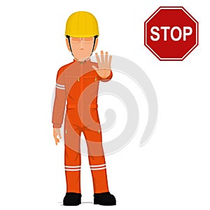 An industrial worker is raise hand to stop