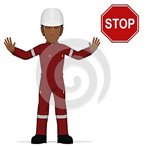 An industrial worker is raise hand to stop