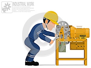 An industrial worker is repairing machine