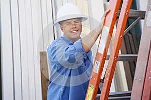 Industrial Worker Standing By A Ladder