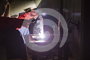 Industrial worker use electric weld steel