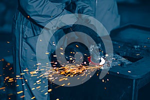 Industrial Worker Using Angle Grinder and Cutting a Metal Plate. Heavy Metal Industry Engineering Factory graphic for advertising