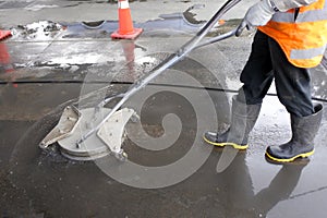 Industrial worker using a surface cleaner