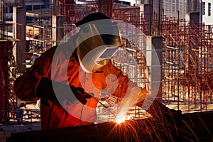 Industrial worker welding steel structure